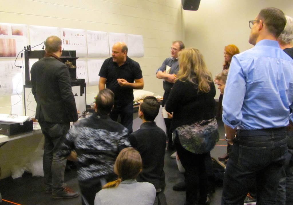 Director Casey Nicholaw (center) presents the set design to the cast on the first day of rehearsals.