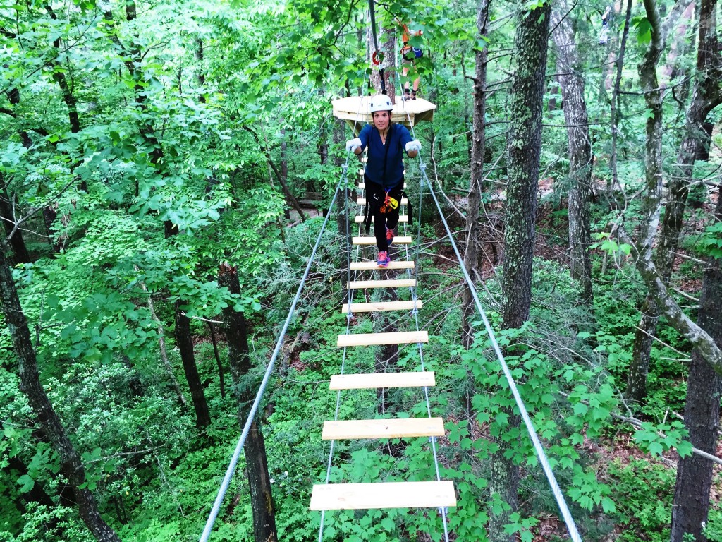 Suspension bridges link some trees on the zip line course. Expect some serious sway but don't fret. You're always tethered to a safety cable. Photo: Phil Kloer 