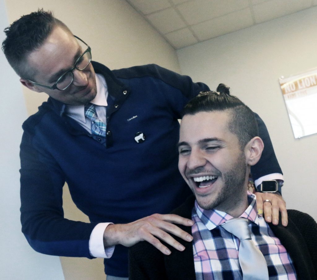 Dr. Christopher Odom (left) and community relations manager Niko Chaniotakis.