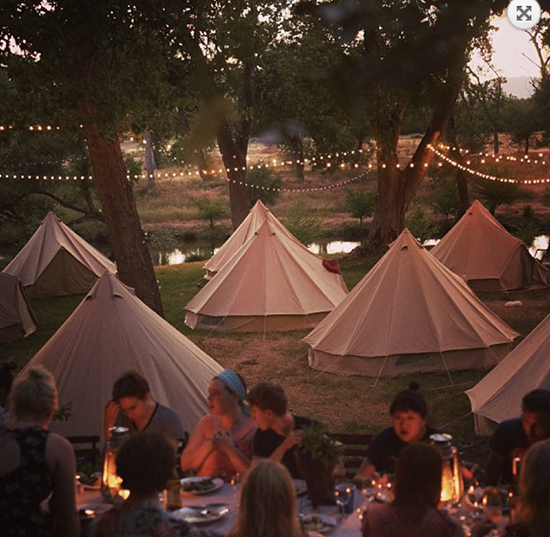 Dinner with friends beneath the stars and twinkling lights.